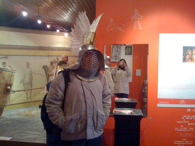 [Photo of MadAlfred in a Gladiator headgear in the Roman ruins of Carnuntum, Austria, March,2008]